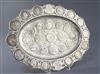 An early 20th century German 800 standard silver oval dish inset with numerous, mainly continental coins, gross 34 oz.                 