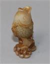 A Chinese jade fish snuff bottle                                                                                                       