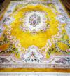 A Chinese gold ground medallion carpet 375 x 275cm                                                                                     