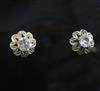 A pair of gold and solitaire diamond ear studs,                                                                                        