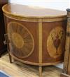 A Sheraton style marquetry inlaid demi-lune side cabinet W.124cm                                                                       