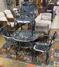 A circular painted aluminium garden table, diameter 76cm, height 70cm and three similar elbow chairs                                                                                                                        