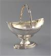 A George III silver boat shaped pedestal sugar basket by Peter & Ann Bateman, 7 oz.                                                    