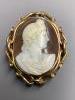 A Victorian yellow metal mounted oval cameo shell brooch, carved with the bust of a lady to sinister, 66mm                                                                                                                  