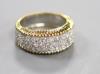 A modern 18ct gold and pave set diamond dress ring                                                                                                                                                                          