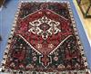 A Persian red ground carpet 200 x 143cm                                                                                                