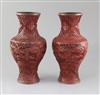 A pair of Chinese cinnabar lacquer baluster vases, 19th century, height 25.5cm                                                         