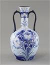 A Moorcroft Florian ware two handled vase, c.1900, H.21.5cm, one handle repaired                                                       