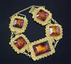 An Indian yellow metal and amber set cannetile work bracelet.                                                                          