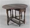 An early 18th century yew wood gateleg table, W.3ft 1in. D.3ft 5in. H.2ft 4in.                                                         