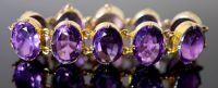 A Victorian style gold and ten stone oval cut amethyst set bracelet,                                                                   