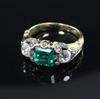 A 19th century gold, single stone emerald and two stone diamond ring, size M/N                                                         