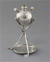 A late Victorian novelty silver and ivory mounted table club lighter, modelled as a golf ball above three crossed golf club supports.  
