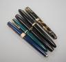 4 fountain pens and a ball point pen                                                                                                                                                                                        