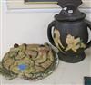 An Art pottery lidded jar decorated with sumo wrestlers and a wall plaque                                                              