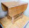 A small 'Beaverman' oak drop leaf occasional table with adzed top, 63cm extended, width 56cm, height 48cm                                                                                                                   