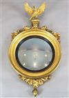 A Regency style giltwood convex wall mirror, W.2ft 1in. H.3ft 10in.                                                                    