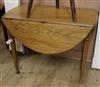 An oak oval topped Pembroke table 99cm                                                                                                 