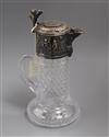 A 925 white metal mounted cut glass claret jug with Bacchanalian decoration, 29.5cm.                                                   