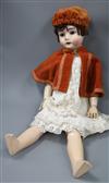 A bisque headed doll by "Max Handwerk" Germany length 70cm                                                                             