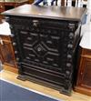 A late 19th century Flemish carved oak pier cabinet W.91cm                                                                             