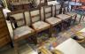 A set of six Regency provincial mahogany dining chairs with drop in rush seats                                                                                                                                              