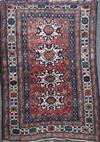 A Caucasian red ground rug, 6ft 10in by 5ft 3in                                                                                        