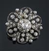An Edwardian gold, silver and diamond cluster flower head pendant brooch, 28mm.                                                        