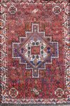 A Shiraz design red ground rug, 5ft 3in by 3ft 8in.                                                                                    