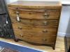 A Regency mahogany satinwood banded bow-fronted chest, fitted brushing slide and four drawers on swept bracket feet, width 92cm depth 51cm height 90cm                                                                      