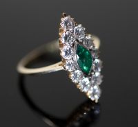 A Victorian style gold, emerald and diamond cluster set marquise shaped ring,                                                          