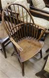 An early 19th century elm and ash stick back elbow chair                                                                               