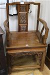 A pair of Chinese carved hardwood elbow chairs                                                                                         