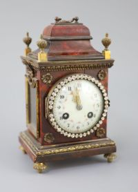 An early 20th century red tortoiseshell veneered mantel timepiece, height 8in.                                                         
