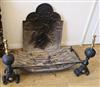 A pair of fire dogs and a cast iron fireback Fire basket W.90cm Fireback W.50cm                                                        