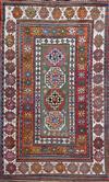 An antique Caucasian polychrome ground rug, 7ft 3in by 4ft 8in.                                                                        