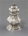 A George I Britannia standard silver pepper of square baluster form with engraved decoration, Edward Wood, 89mm.                       