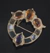 A late Victorian engraved gold, Scottish hardstone, amethyst and citrine set openwork brooch, 74mm.                                    