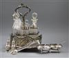 A pair of Victorian silver cauldron salts, a pair of silver peppers, sugar tongs. two spoons and a plated 7-bottle cruet               