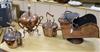 A collection of Victorian copperware, consisting of two kettles, a spirit kettle on stand and a coal helmet (4)                        