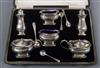 A cased George V silver six piece condiment set by Synyer & Beddoes.                                                                   