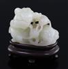 A Chinese pale celadon jade figure of a lion dog and cub, 18th/19th century, L. 6cm, wood stand                                        