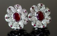 A pair of modern continental 18k white gold, ruby and diamond set oval cluster flower head earrings,                                   