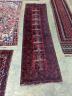 A Belouch red ground runner, 274 x 77cm                                                                                                                                                                                     