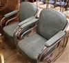 A pair of chrome plated and green vinyl scroll framed elbow chairs                                                                     