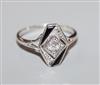 An Art Deco style white metal, diamond and black onyx dress ring, size L.                                                              