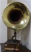 A gramophone with brass horn                                                                                                           