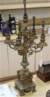A Victorian gilt metal candelabrum now converted to a table lamp H.72cm.                                                               