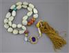 A Chinese pale celadon jade pebble and hardstone necklace, probably Republic period, total drop incl. silk tassle pendant 72.5cm       