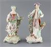 A pair of large Derby figures of flower sellers, c.1760, H. 26.5 and 24.5cm                                                            